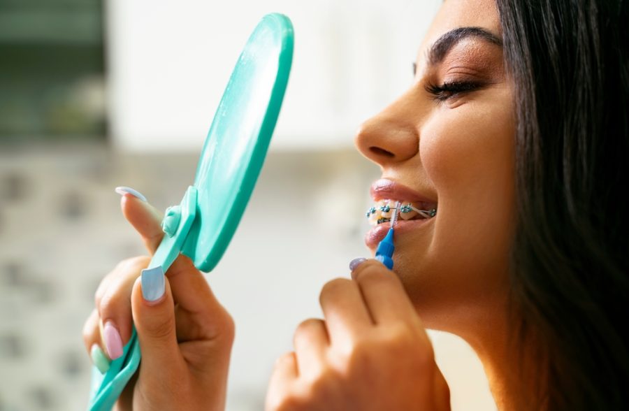 With braces, it's advisable to brush your teeth after every meal or snack. If brushing isn't immediately possible, rinsing your mouth